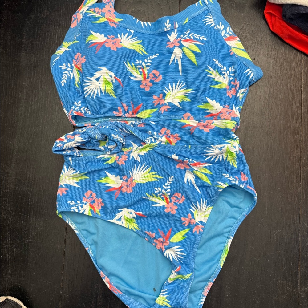 Jessica Simpson new without tags large bathing suit. ￼ Beautiful vibrant colors.